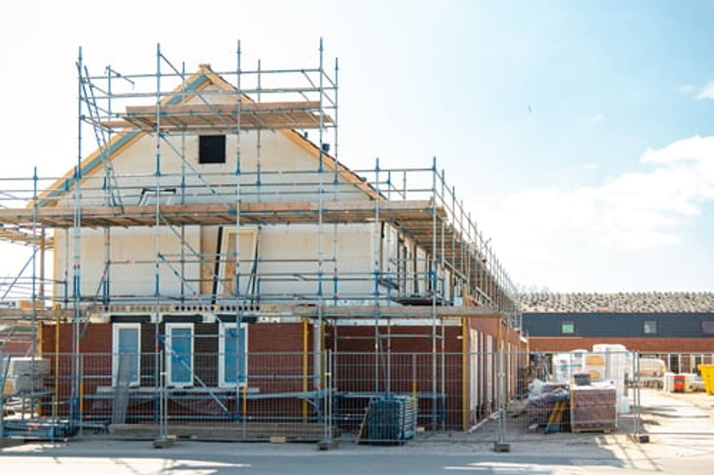 Home under construction with scaffolding on a G&I B Construction project site
